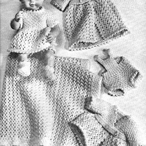 May include: A knitted doll outfit set with a dress, a cardigan, a hat, and a nappy cover. The set is made of a soft, white yarn and is perfect for a small doll.