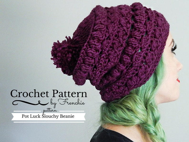 May include: Purple crochet slouchy beanie with a pom pom on top. The beanie is made with a textured stitch and has a slouchy fit. The pattern is called "Pot Luck Slouchy Beanie" by Frenchie.