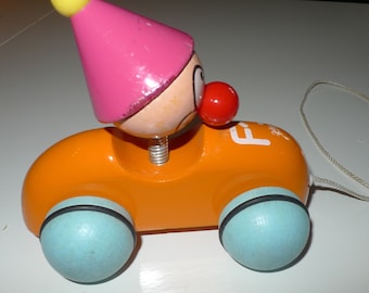 Petit jouet en bois vintage qui roule