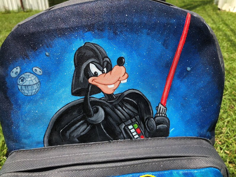 Custom painted backpack with three characters-