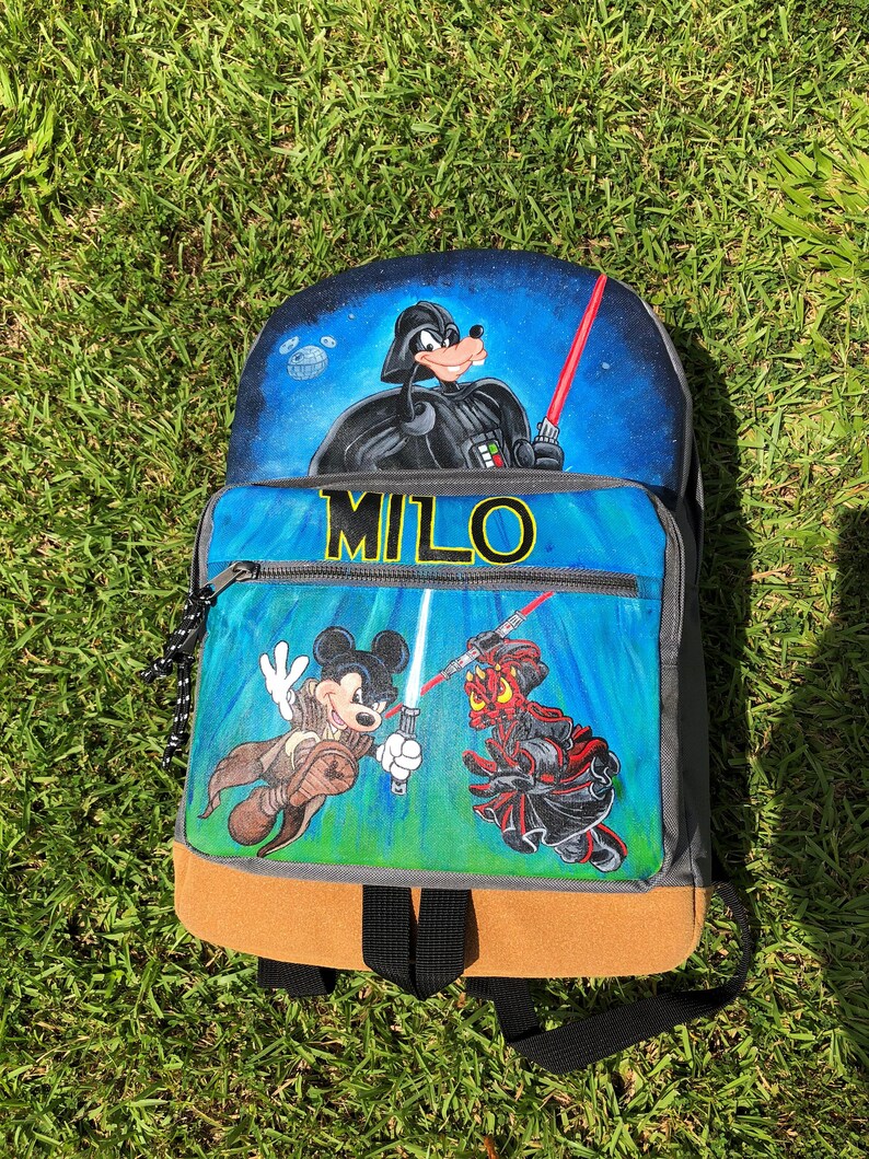 Custom painted backpack with three characters-
