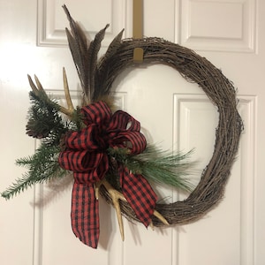 Rustic Grapevine with Antlers and Pheasant Feather Wreath