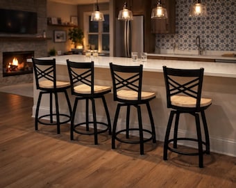 May include: Four black metal swivel bar stools with light wood seats and backs with an X-shaped design. The stools are positioned in front of a white countertop in a kitchen setting. The floor is hardwood.