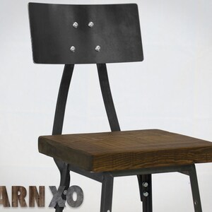 May include: A black metal chair with a wooden seat. The chair has a curved back and a simple design.