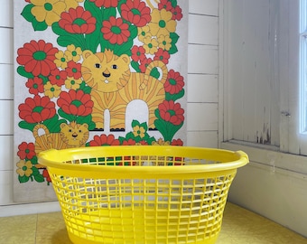 Vintage yellow plastic laundry basket hamper