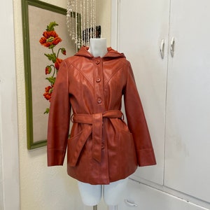 Vintage vinyl jacket/K Mart Leatherlook orange raincoat
