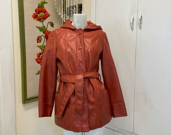 Vintage vinyl jacket/K Mart Leatherlook orange raincoat