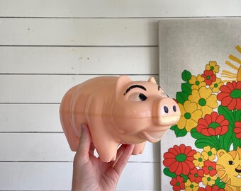 Vintage plastic hat tipping piggy bank