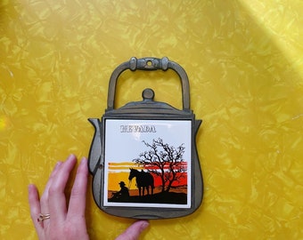 Vintage Nevada tile and cast iron trivet