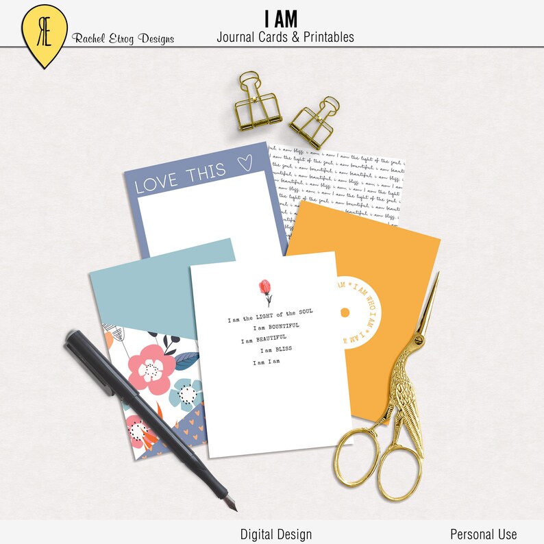 May include: Four printable journal cards with inspirational text. The cards feature a floral design, a simple white card with text, a blue card with the words "LOVE THIS" and a yellow card with a circle and the text "I AM WHO I AM".
