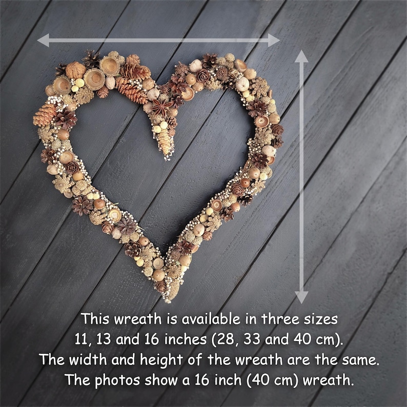 May include: A heart-shaped wreath made of natural materials like pinecones, acorns, and berries. The wreath is available in three sizes: 11, 13, and 16 inches. The photo shows a 16-inch wreath.