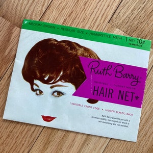 May include: A vintage advertisement for Ruth Barry hair nets. The ad features a woman with brown hair and a close-up of her eyes. The text reads "Ruth Barry Invisible DuPont Nylon Hair Net*" and "Invisible Front Edge Hidden Elastic Back".
