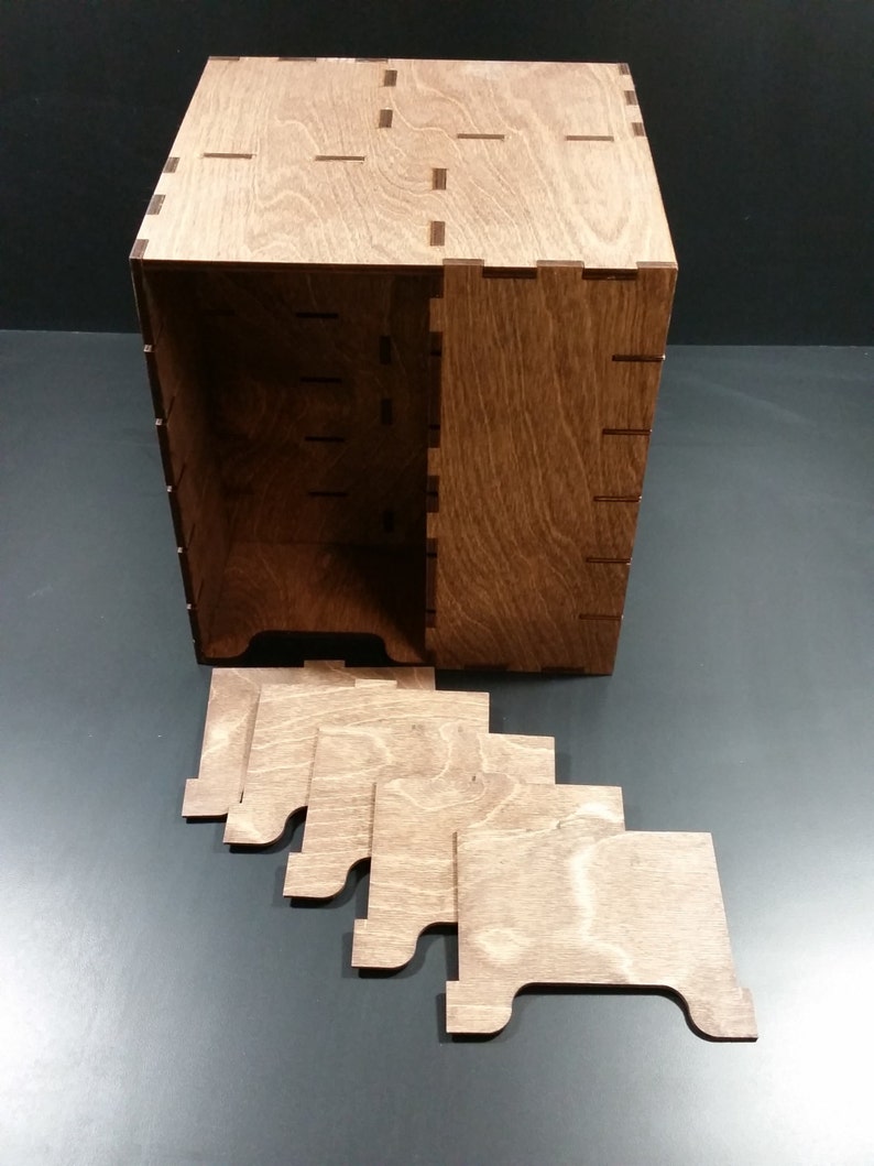 May include: A wooden box with a lid and five separate wooden dividers. The box is made of light brown wood and has a natural wood finish.