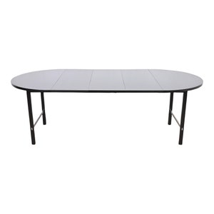 May include: A black oval folding table with a wood top and black metal legs. The table is extended to its full length.