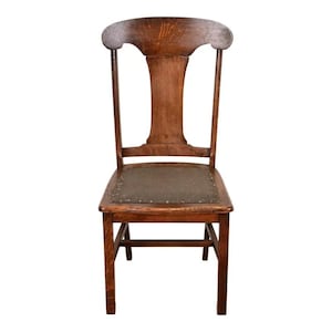 May include: A wooden chair with a curved back and a woven seat. The chair is made of a light brown wood and has a classic design. The chair is a vintage piece and would be a great addition to any home.