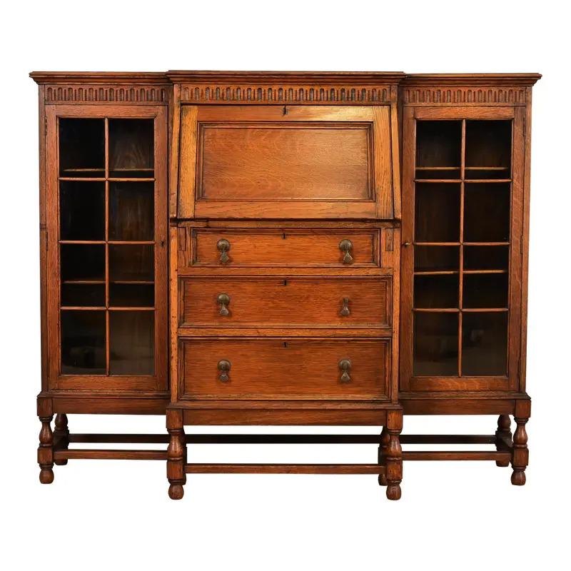 Antique English Jacobean Carved Oak Glass Front Double Bookcase