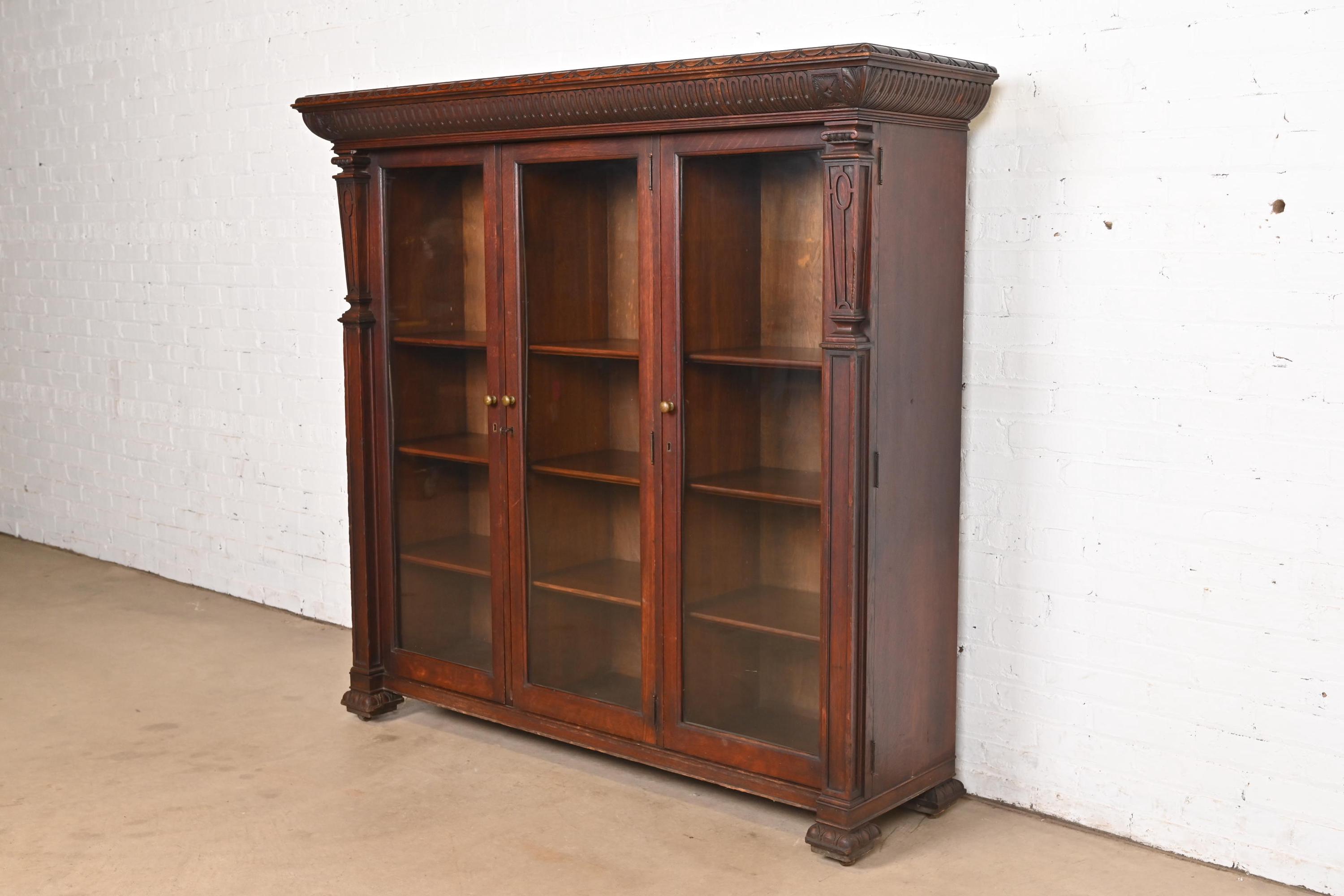 R. J. Horner Style American Empire Carved Oak Glass Front Triple