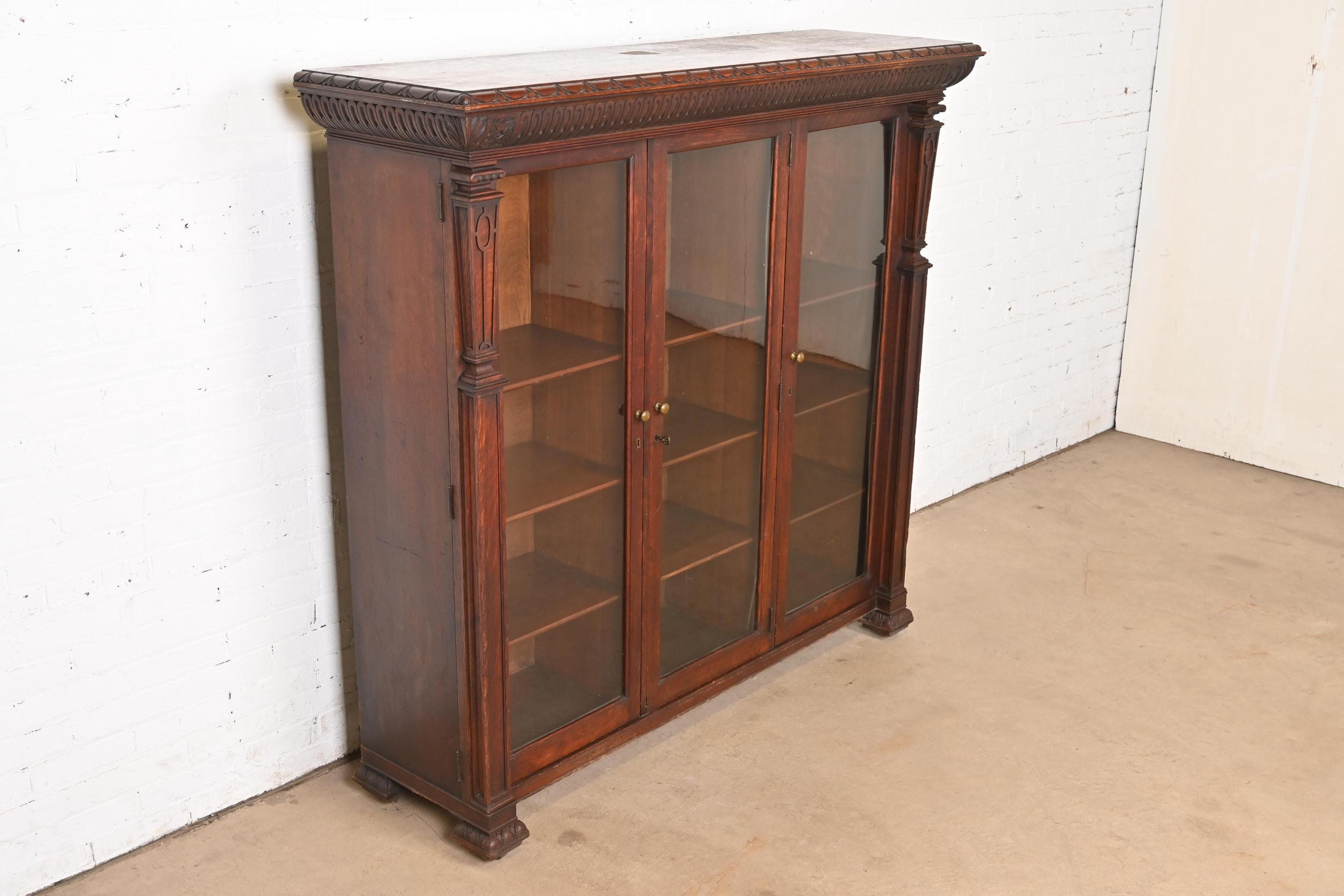 R. J. Horner Style American Empire Carved Oak Glass Front Triple