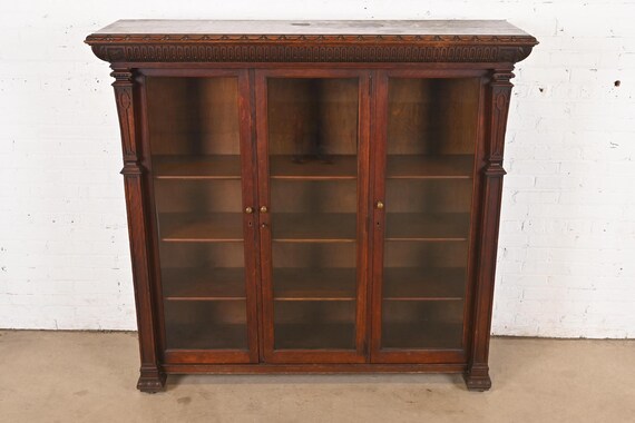 R. J. Horner Style American Empire Carved Oak Glass Front Triple
