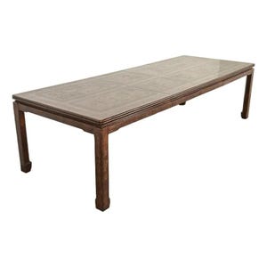 May include: A long, rectangular wooden table with a dark brown finish. The tabletop features a detailed, carved pattern. The table has four sturdy legs and is suitable for dining or display. The table measures approximately 96 inches long.