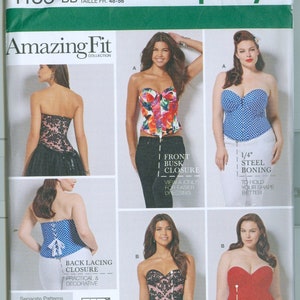 May include: Simplicity Amazing Fit sewing pattern 1183 BB. The pattern features multiple bustier designs, including a floral print, polka dots, and lace. The pattern includes sizes 20W-28W and offers various construction details like steel boning and back lacing.