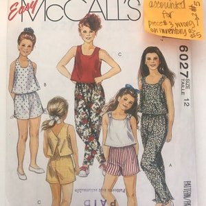 May include: A set of three ceramic mugs with a speckled, matte finish. The mugs are in shades of cream, light gray, and dark gray. Each mug has a simple, minimalist design, perfect for coffee or tea.