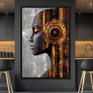 May include: Abstract art print featuring a black and gold profile of a person's face with geometric patterns. The background is a grey and white textured canvas.