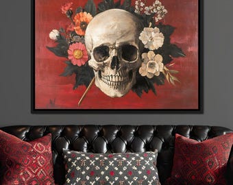 May include: A framed canvas art print featuring a detailed skull with a bouquet of flowers against a red background. The skull is white with dark eye sockets and a full set of teeth. The flowers are in shades of pink, orange, and white.