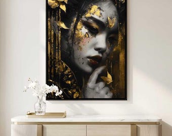 Peut inclure: Impression artistique encadrée représentant un portrait en niveaux de gris d'une femme ornée de feuilles d'or. L'œuvre, dans un cadre noir, est accrochée à un mur blanc au-dessus d'un meuble en bois. La femme a les cheveux foncés et du rouge à lèvres rouge.
