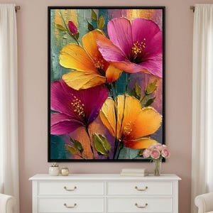May include: A framed floral painting with textured flowers in yellow, orange, and magenta. The artwork has a dark background with green and blue hues. The painting is displayed above a white chest of drawers.