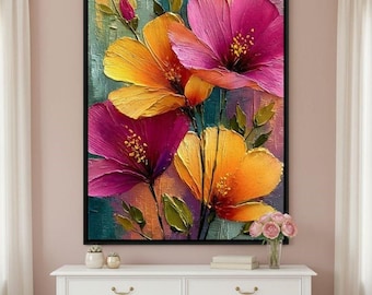 May include: A framed floral painting featuring vibrant, textured flowers in shades of yellow, orange, and magenta. The artwork has a dark background with green and blue hues, and is displayed above a white dresser.