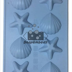 May include: A light blue silicone mold with six cavities shaped like seashells and starfish. The mold is designed for making soap, candles, or other crafts.