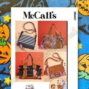 May include: A sewing pattern for four different styles of handbags. The pattern is from McCall's and is numbered M8467. The handbags are shown in different colours and fabrics, including black and white striped, floral, brown leather, and leopard print.
