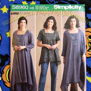 May include: Simplicity sewing pattern S8960 for women's dresses and tops. The pattern features three different styles, including a long dress and a tunic top. The pattern includes sizes US 6-14. The cover has a blue background.