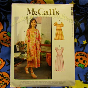 May include: McCall's sewing pattern R11048 featuring three dress designs. The cover shows a woman wearing a floral print dress. The pattern includes sizes A5 (6-8-10-12-14).