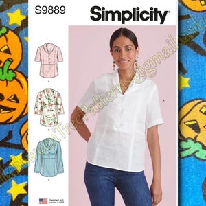 May include: Simplicity sewing pattern S9889 featuring a woman wearing a white short-sleeved blouse. The pattern includes illustrations of three different blouse designs. The text "Designed and printed in USA" is also visible.
