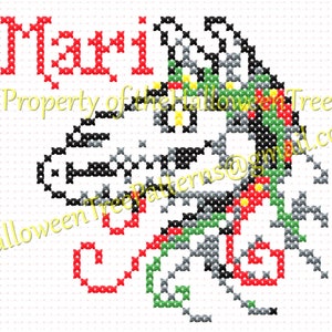 May include: Cross-stitch pattern featuring the word "Mari" in red, with a stylized design in black, gray, green, and red. The text "Property of the Halloween Tree" and an email address are also visible.