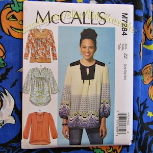 May include: A sewing pattern for a women's blouse with a keyhole neckline and long sleeves. The pattern is from McCall's and is size ZZ (Large-Extra Large-Extra Extra Large).