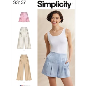 May include: Simplicity pattern S3137 features illustrations of shorts and pants in pink, beige, and tan. The model wears a white tank top and light blue shorts. The text "Simplicity" and "S3137" are visible.