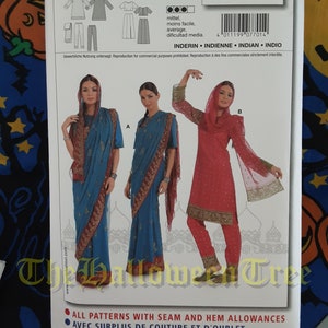 May include: Burda sewing pattern number 7701 for an Indian-style dress. The pattern includes instructions for a long, flowing skirt, a top with long sleeves, and a matching scarf. The pattern is available in sizes 8 to 20.