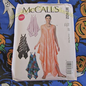 May include: A sewing pattern for a sleeveless dress with a V-neck and a high-low hemline. The pattern includes four different styles of the dress, with different colors and patterns. The pattern is labeled "McCall's M7402" and is for sizes Large, Extra Large, and Extra Extra Large.