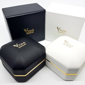 May include: Two black and two white jewelry boxes with gold trim. Each box has the logo "VIDAR JEWELRY" printed on the top.