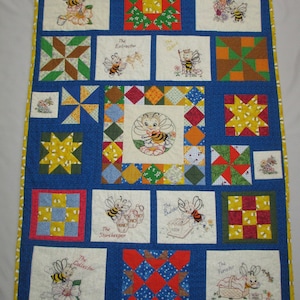 Bee Happy quilt. Hand-made. Unique one-of-a-kind. Hand quilted. 100% cotton. Baby quilt. Bees and flowers, patchwork, unisex baby quilt