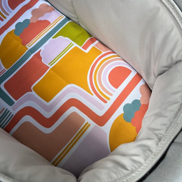 Bassinet liner made for Uppababy Vista, Bugaboo, Redsbaby, Nuna prams and more. Retro rainbows and clouds