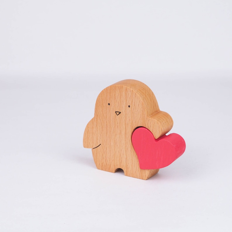 little wooden penguin statue