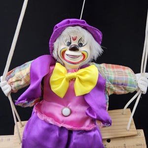 Vintage Swinging Clown Doll – 1980s Circus Decor, Hanging Doll on Wooden Swing, Collectible Clown Figurine