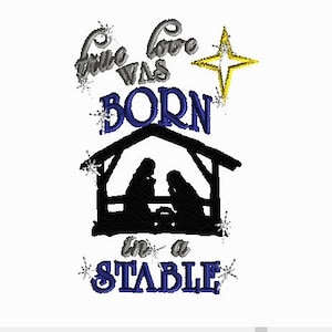 May include: A blue and white embroidery design featuring a manger scene with the text "True love was born in a stable" and a gold star.