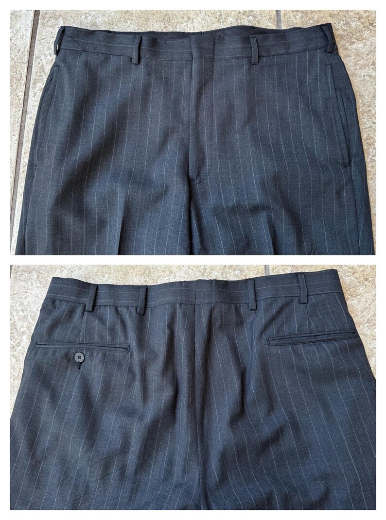 May include: A pair of dark gray pinstripe dress pants with a button on the back pocket.