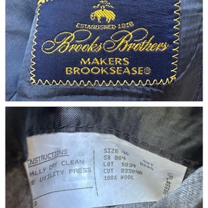 May include: A navy blue suit jacket label with gold embroidery that reads "Brooks Brothers Makers Brookseaseo" and "Established 1818". A white tag attached to the jacket reads "Instructions: Dry Clean, Utility Press, Size 40, 58 804, SHT 8285, Lot 5034, Cut 833048, 100% Wool".
