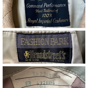 May include: Close-up of vintage garment labels. The labels read "FASHION PARK" and "Broadstreet's" with text indicating the garment is hand-tailored of 100% Royal Imperial Cashmere. Additional label with numbers and text.